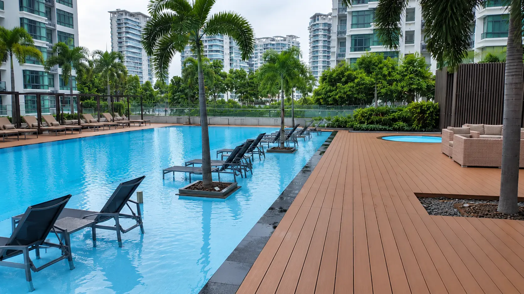 Condominium pool deck with tower blocks behind
